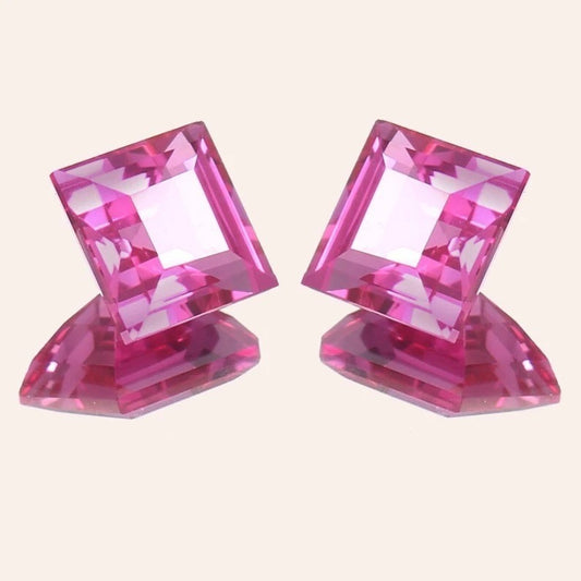 Ceylon Pink Sapphire Pair gemstones on a light beige background