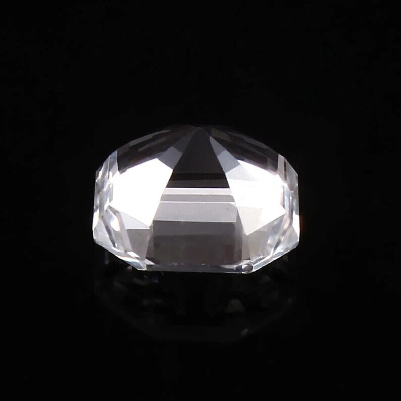 Clear faceted White Sapphire on a black background