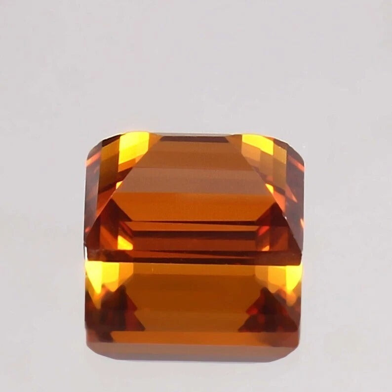 Baguette orange sapphiregemstone on a light gray background