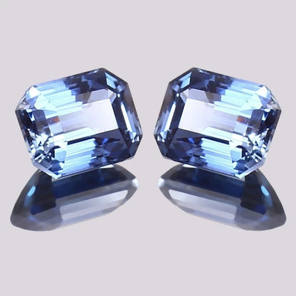 Blue Sapphire Pair gemstones with a light gray background