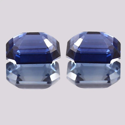 Blue Sapphire Pair gemstones on a light gray background