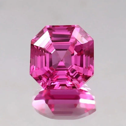 Pink sapphire asscher gemstone with a clear background