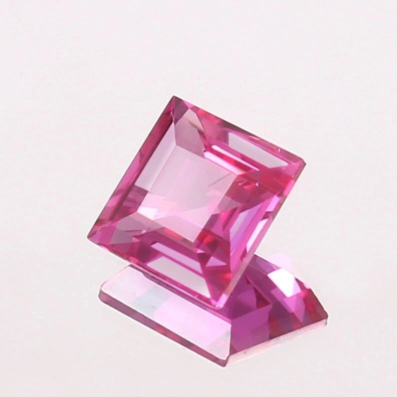 Pink Sapphire gemstone on a light pink background