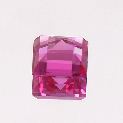 Pink Sapphire gemstone on a light purple background