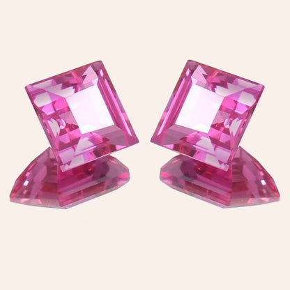 Ceylon Pink Sapphire Pair gemstones on a light beige background