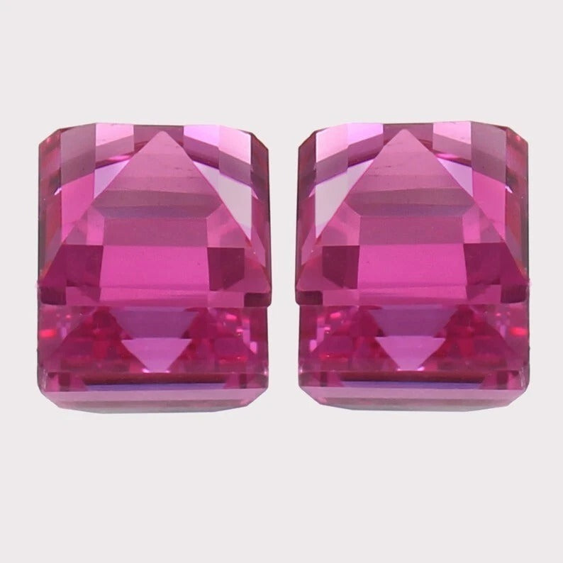Ceylon Pink Sapphire Pair gemstones on a light gray background