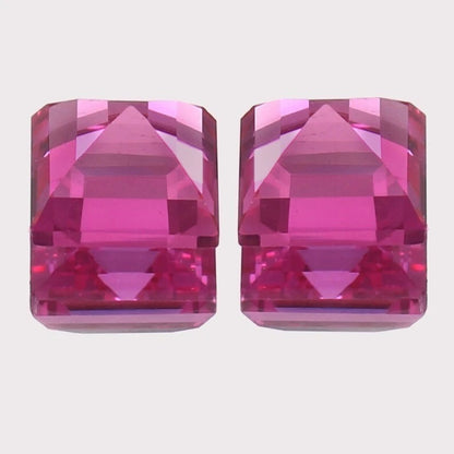 Ceylon Pink Sapphire Pair gemstones on a light gray background