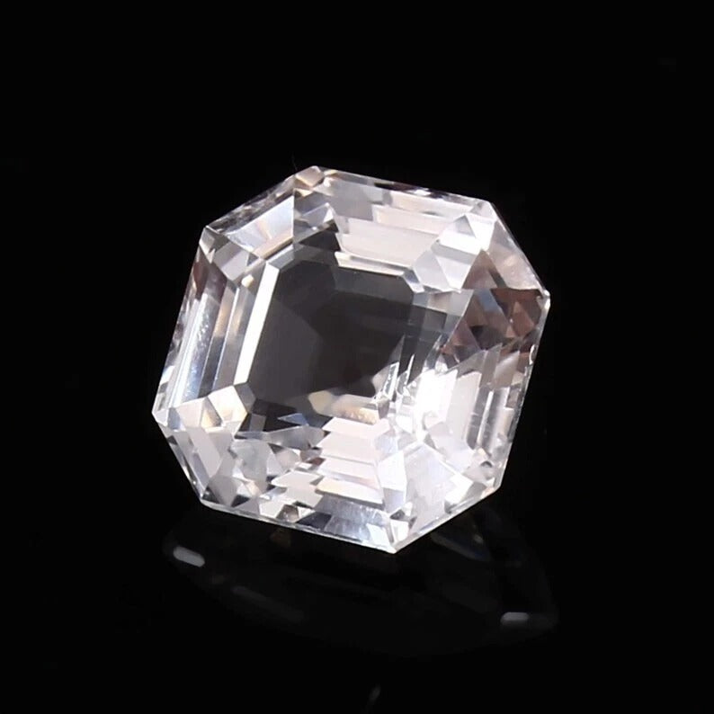 Faceted White Sapphire on a black background