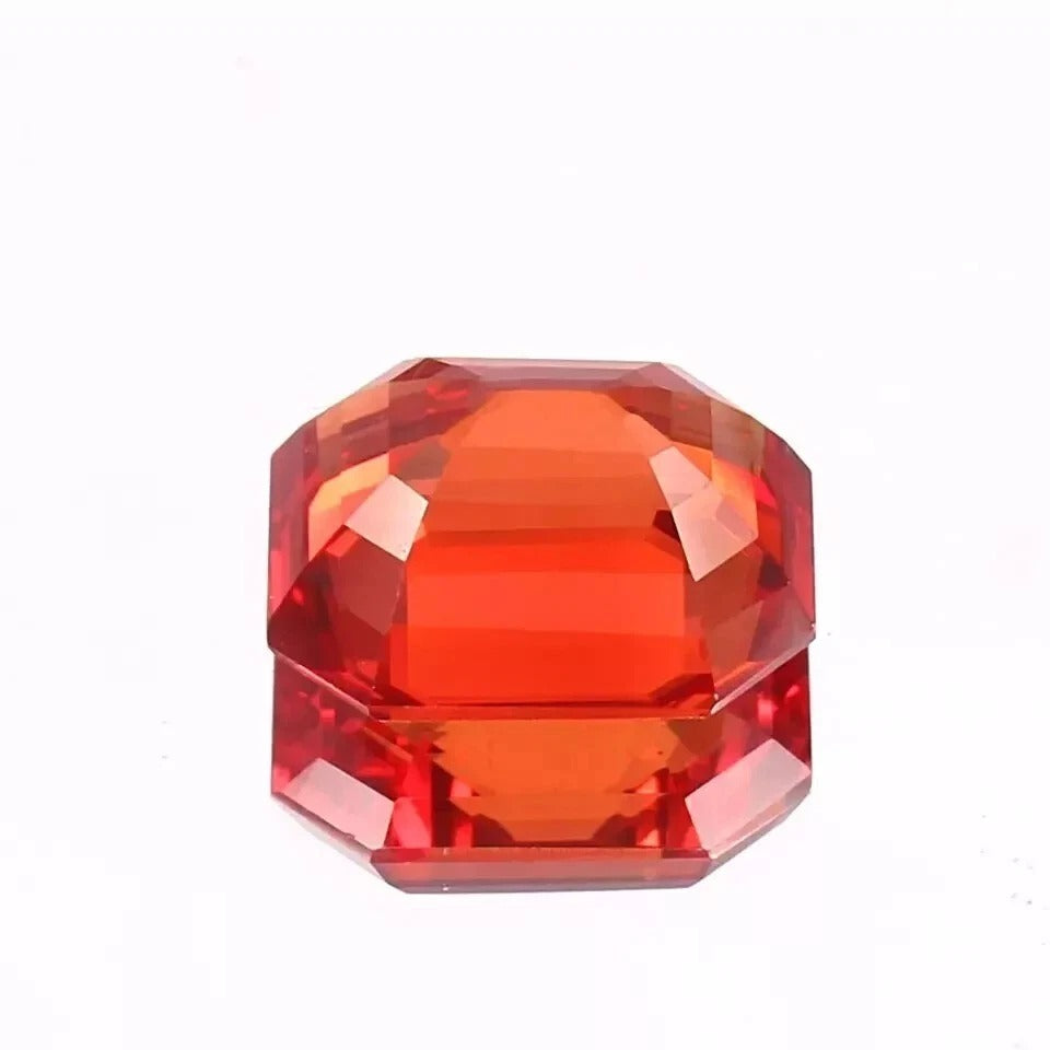 Fanta Orange Sapphire gemstone on a white background