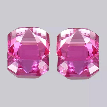 Ceylon Pink Sapphire pair gemstones on a light gray background