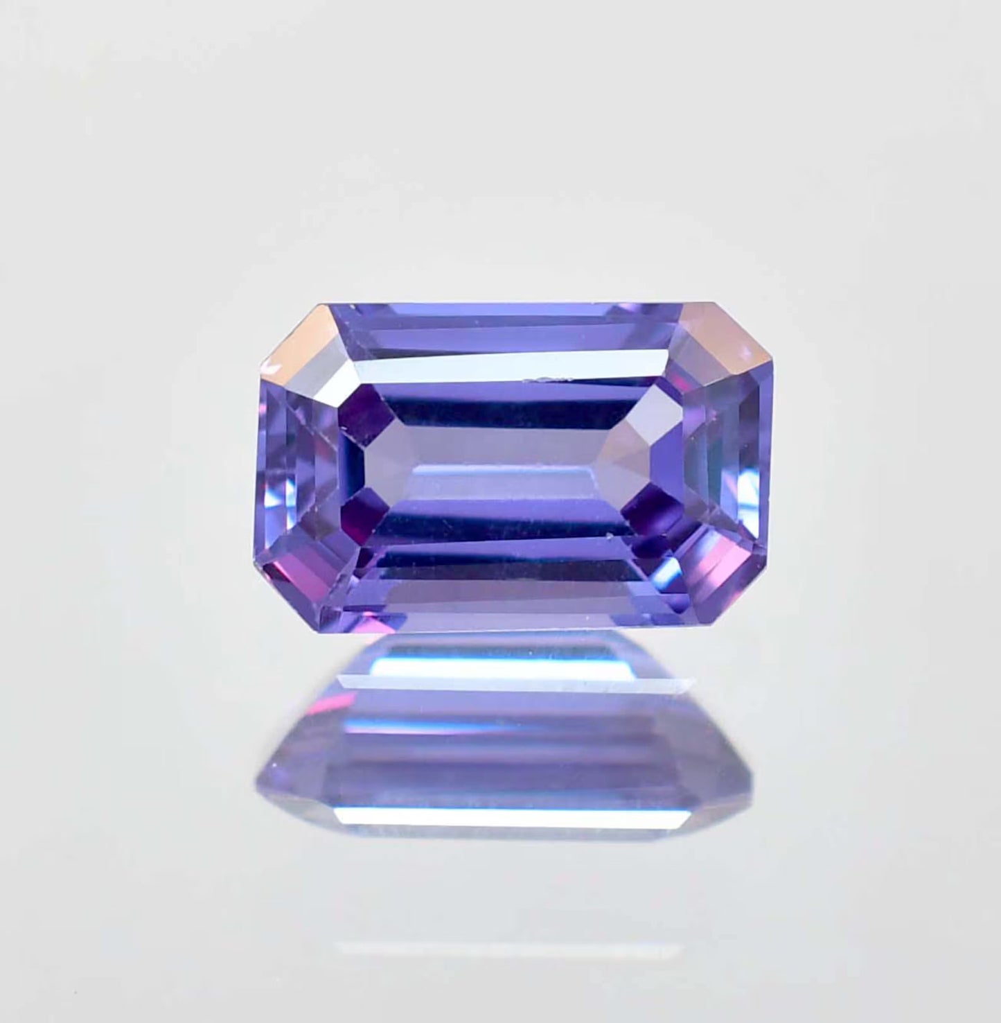 Faceted Alexandrite  gemstone on a white background