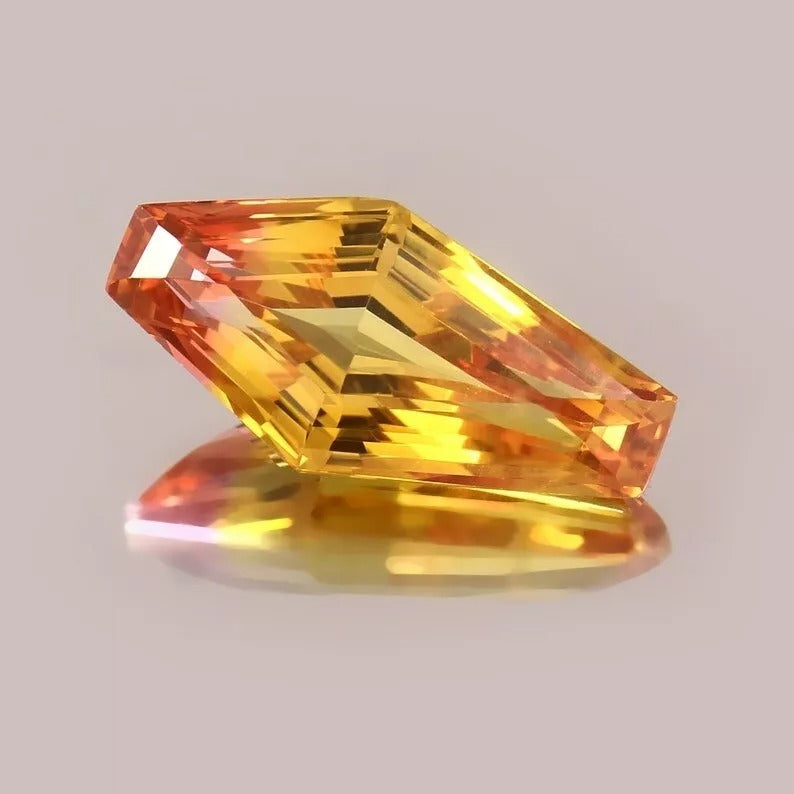 Multicolored Bi-Color Sapphire gemstone on a gray background