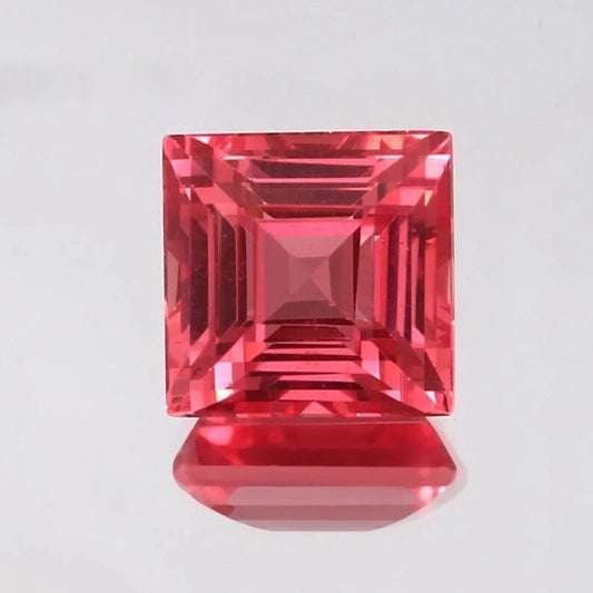 Solomon Color Ceylon Padparadscha Sapphire gemstone on a light gray background