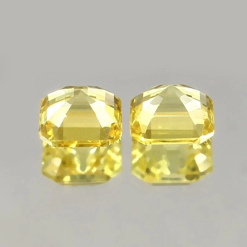 Yellow Ceylon Sapphire Pair gemstones on a gray background