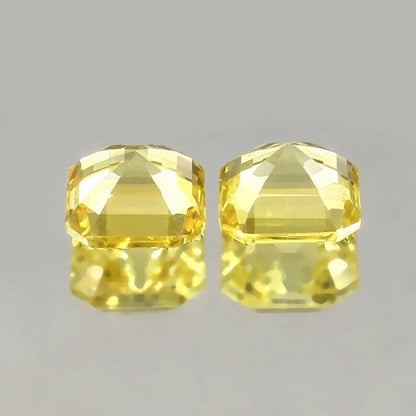Yellow Ceylon Sapphire Pair gemstones on a gray background