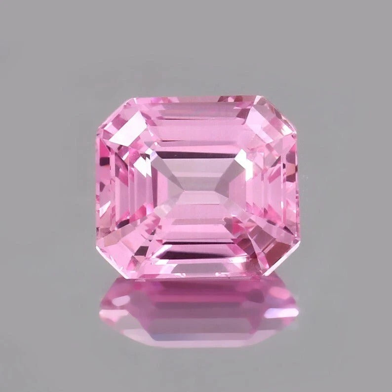 Pink Morganite Madagascar gemstone on a gray background
