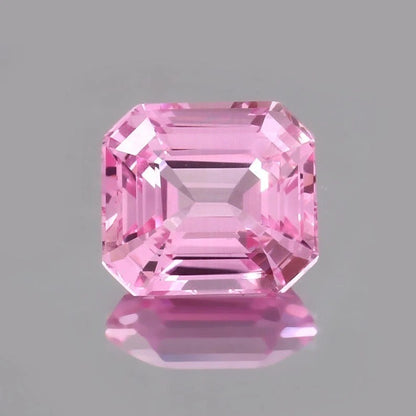 Pink Morganite Madagascar gemstone on a gray background