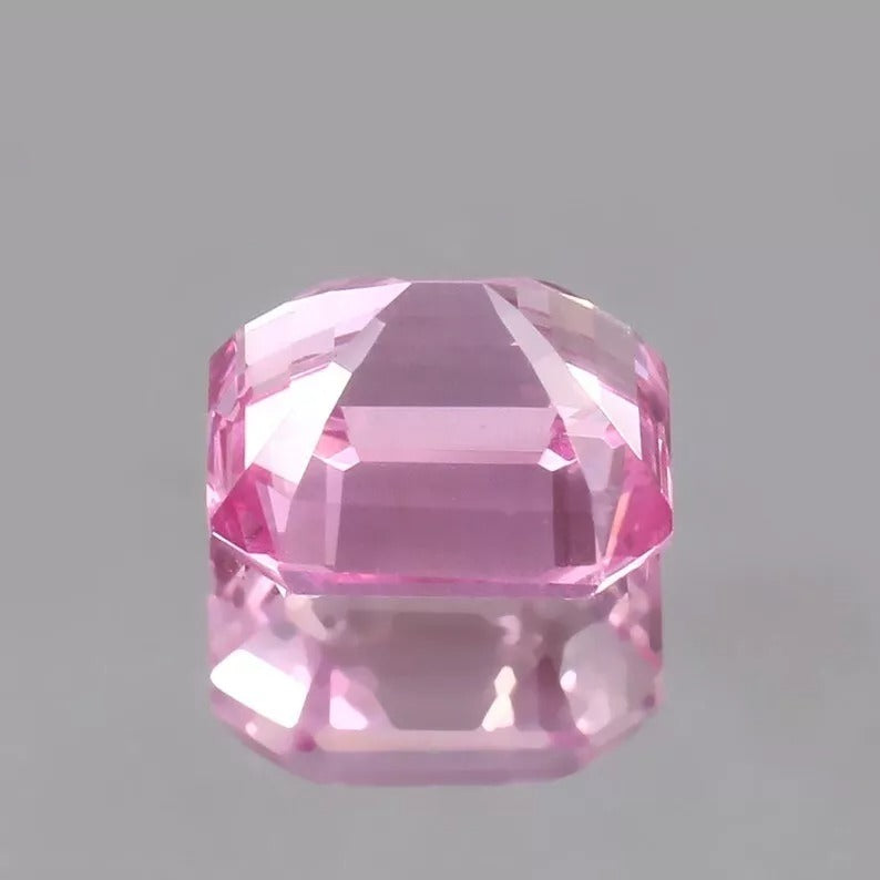 Pink Morganite Madagascar gemstone on a gray background