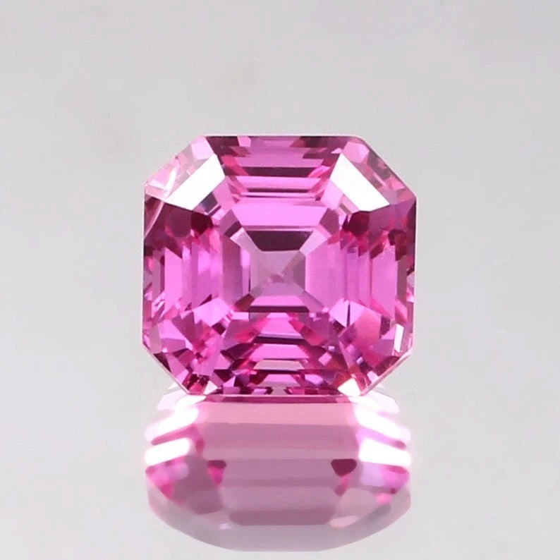 Pink Sapphire Loose Asscher Unheated gemstone with a clear background