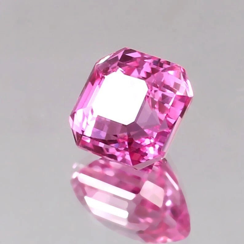 Pink Sapphire Loose Asscher Unheated gemstone on a gray background