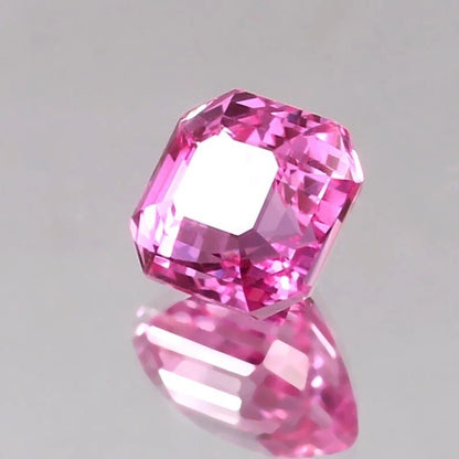 Pink Sapphire Loose Asscher Unheated gemstone on a gray background