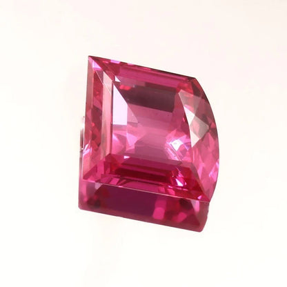 Pink Sapphire Fancy Cut gemstone on a white background