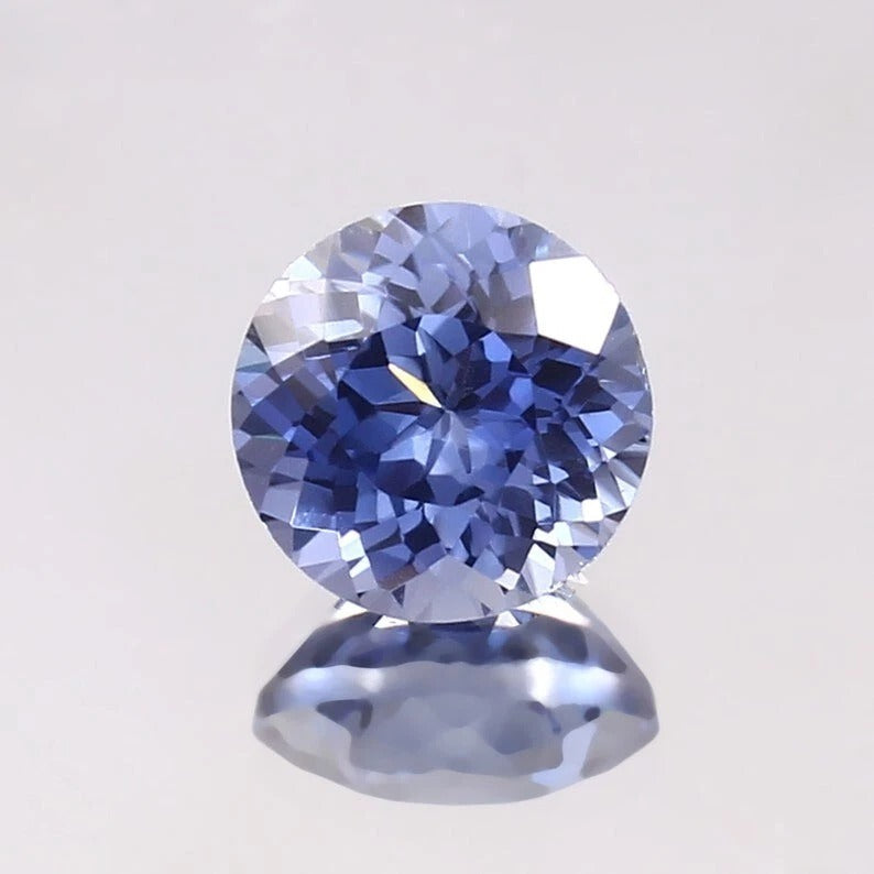 Paste Blue Color Sapphire gemstone on a light gray background