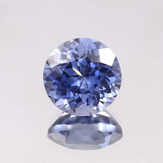 Paste Blue Color Sapphire gemstone on a light gray background