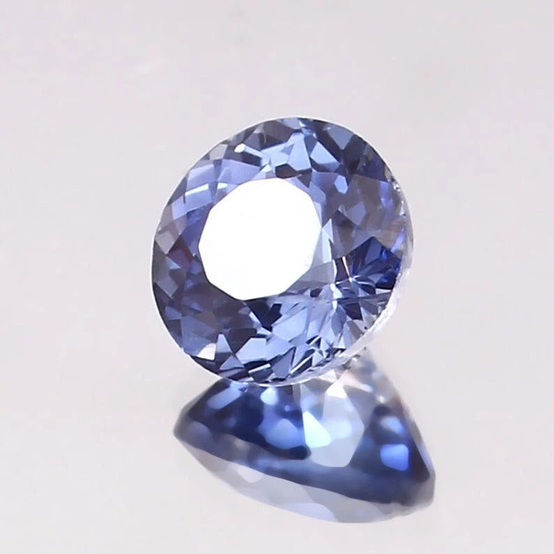 Paste Blue Color Sapphire gemstone on a light gray background
