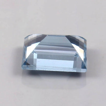 Brazilian Aquamarine Loose Baguette Cutblue gemstone on a light gray background