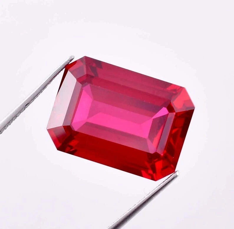 Pigeon Blood Ruby red gemstone on a white background