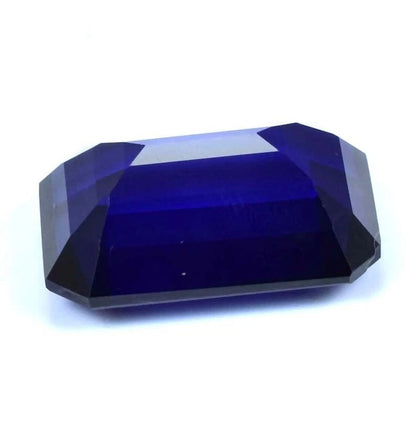 Faceted blue Sapphire gemstone on a white background