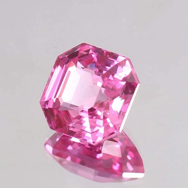 Flawless Ceylon Pink Sapphire gemstone on a gray background