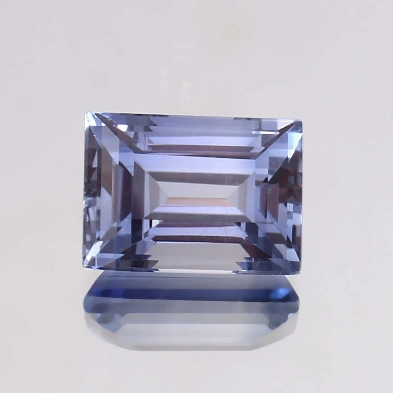 Ceylon Blue Sapphire – Baguette Cut blue gemstone on a light gray background