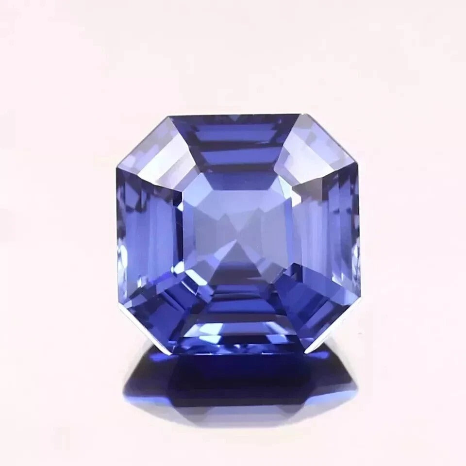Faceted Royal Blue Sapphire gemstone on a white background