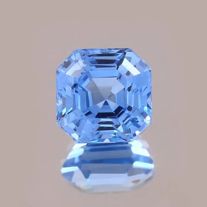 Blue Spinel gemstone with a clear brown background