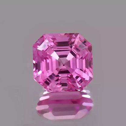 Ceylon Pink Sapphire gemstone on a gray background