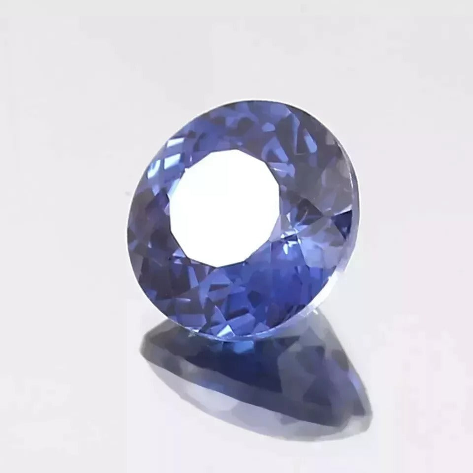 Royal Blue Sapphire Round Cut gemstone on a white background