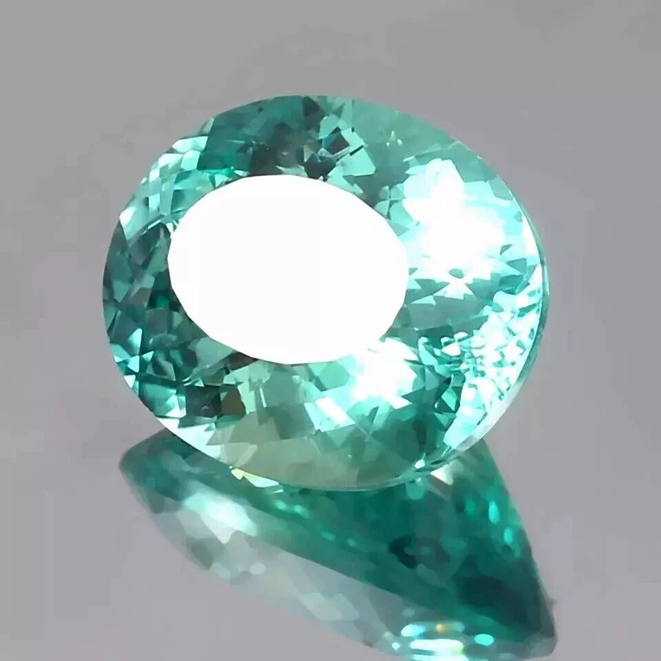 Bi-Color Parti-Sapphire gemstone on a gray background