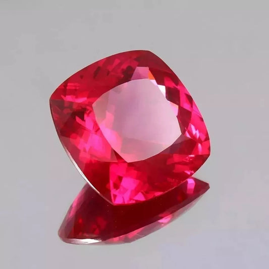 Blood Red Ruby gemstone on a light gray background