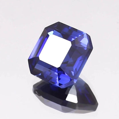 Faceted Cornflower blue sapphire gemstone on a white background