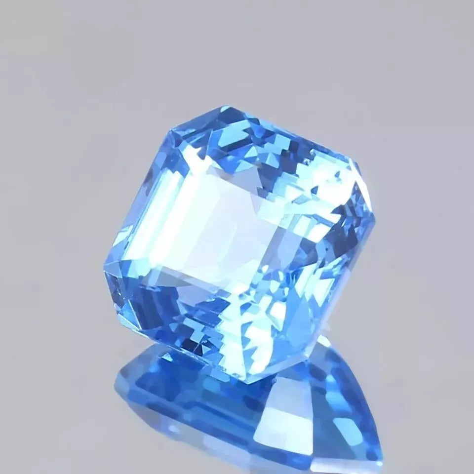 Ceylon Blue Spinel gemstone on a gray background