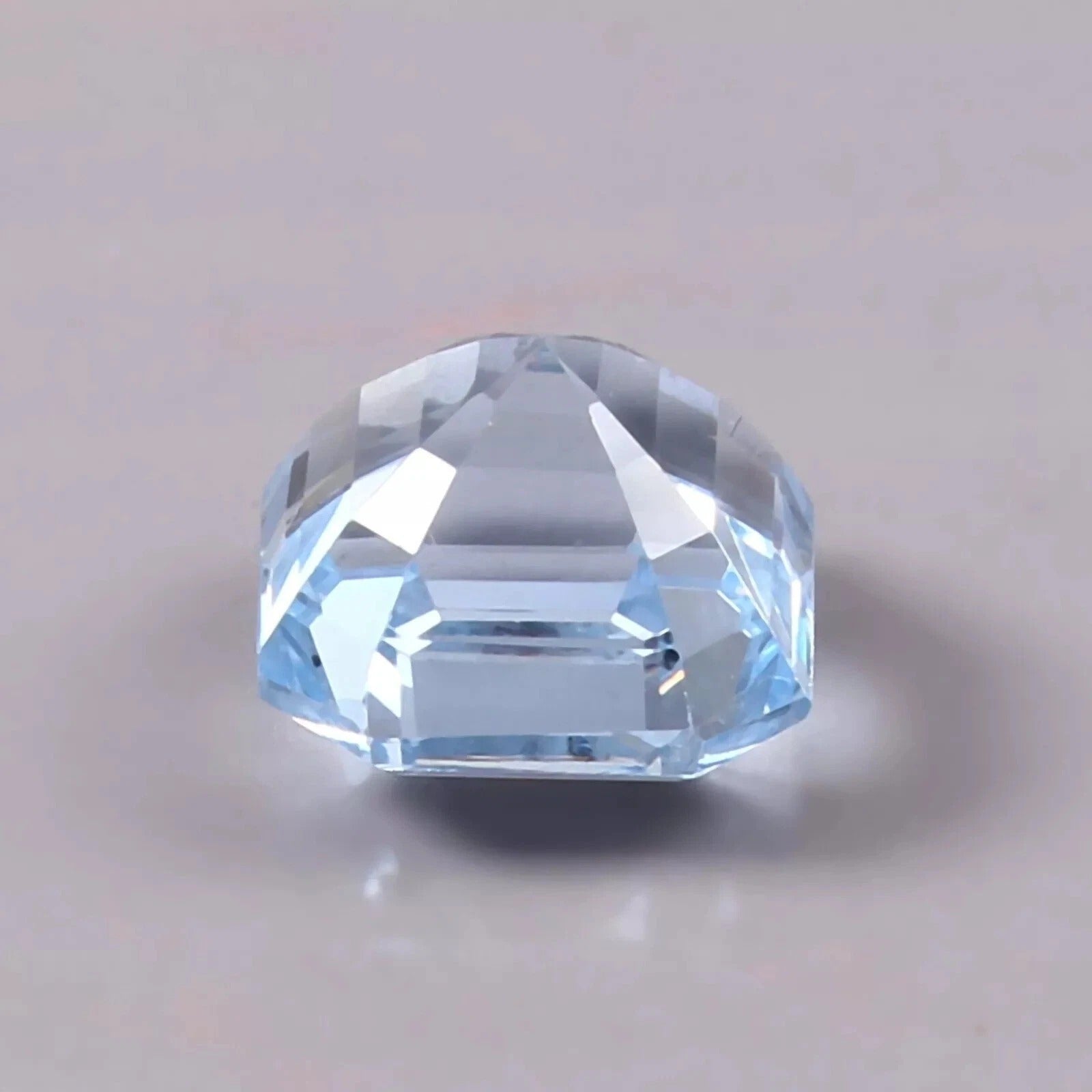 Sky Blue Color Aquamarine gemstone on a light gray background