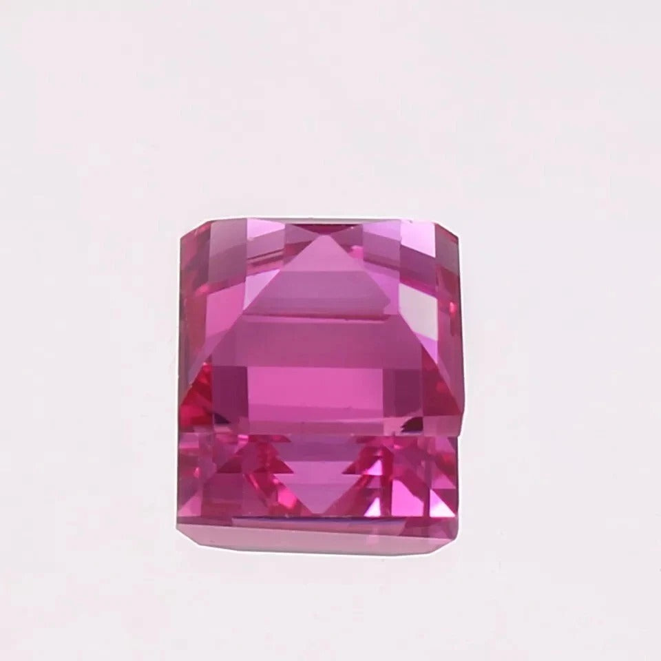 Ceylon Pink Sapphire  gemstone on a light pink background